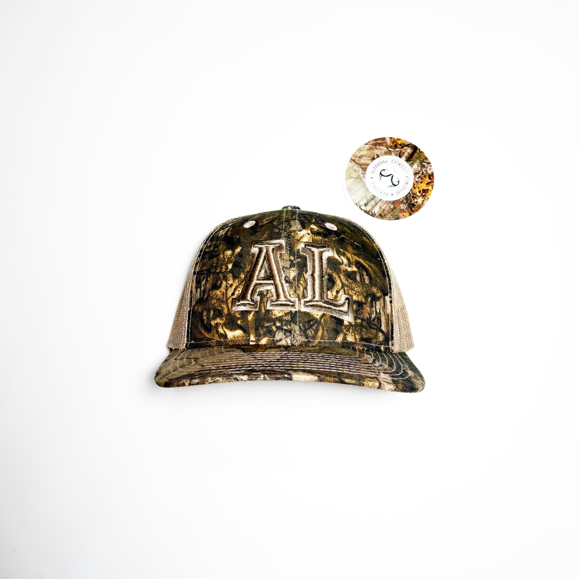 Casquette trucker AL camouflage, merch de la boutique en ligne d'Arpin Lépine